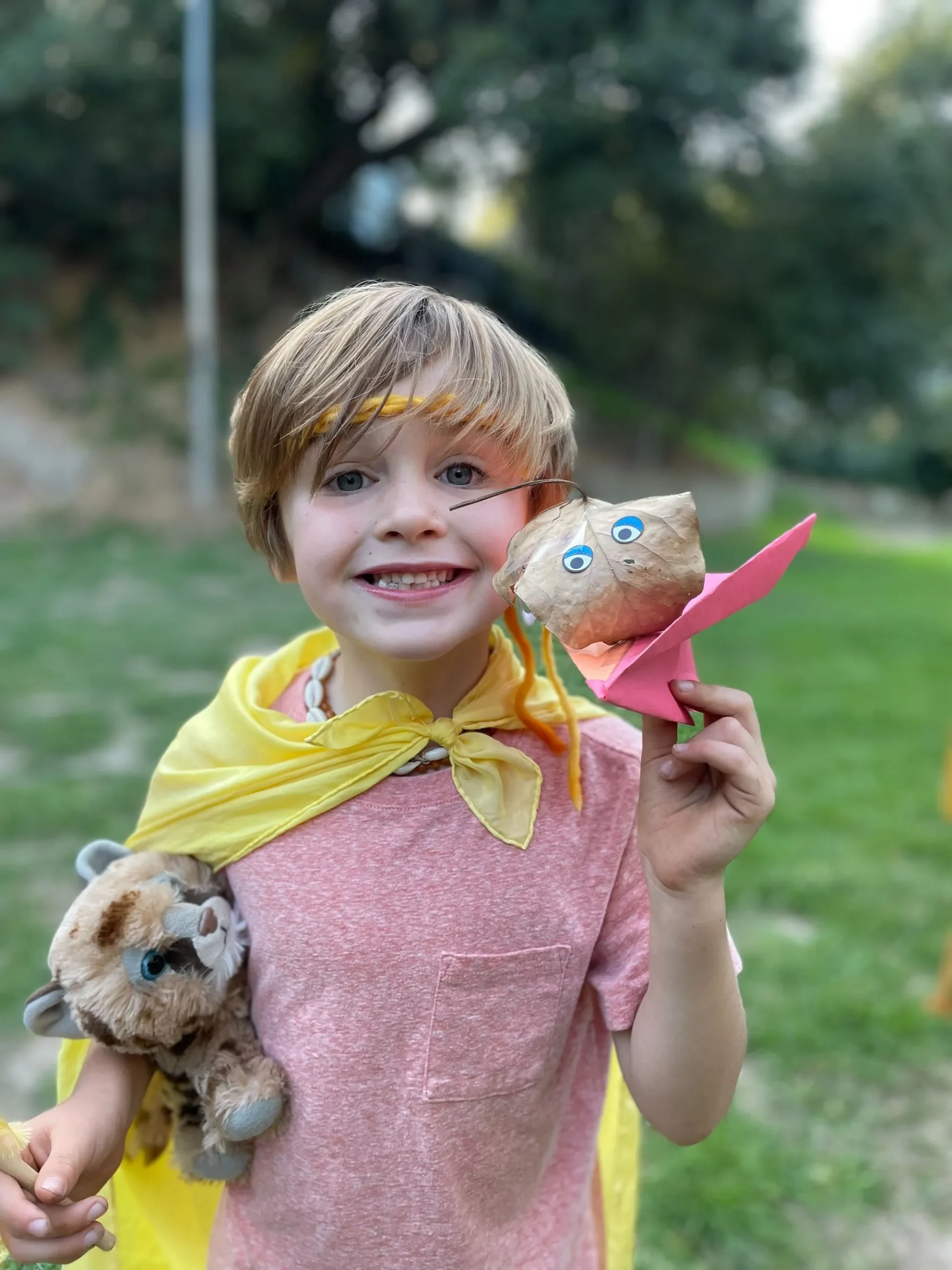 child holding frog nature discovery program
