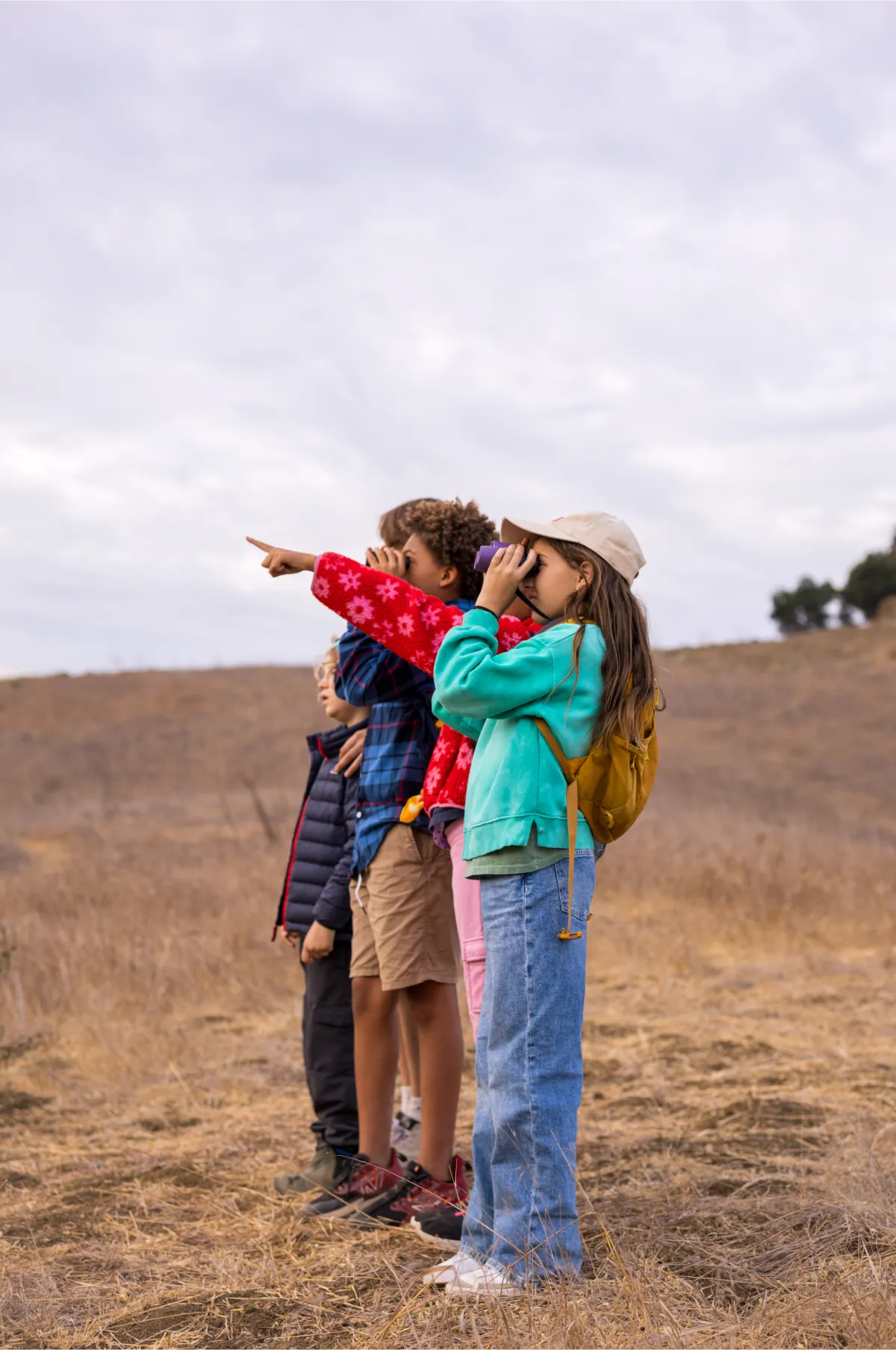kids hugging outdoors friendship nature program