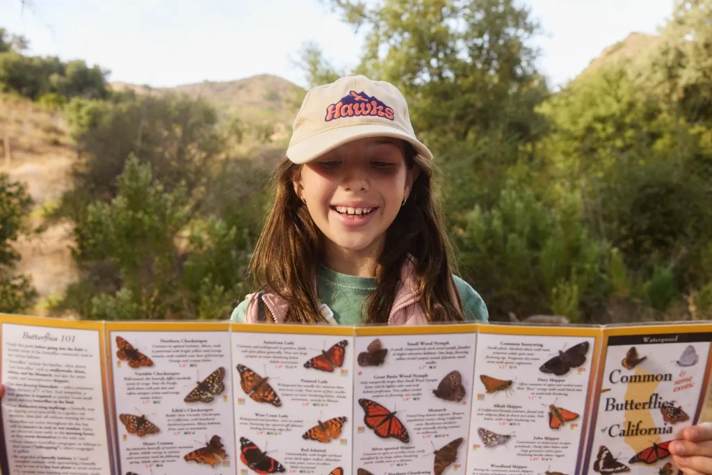 girl smiling outdoors hiking program