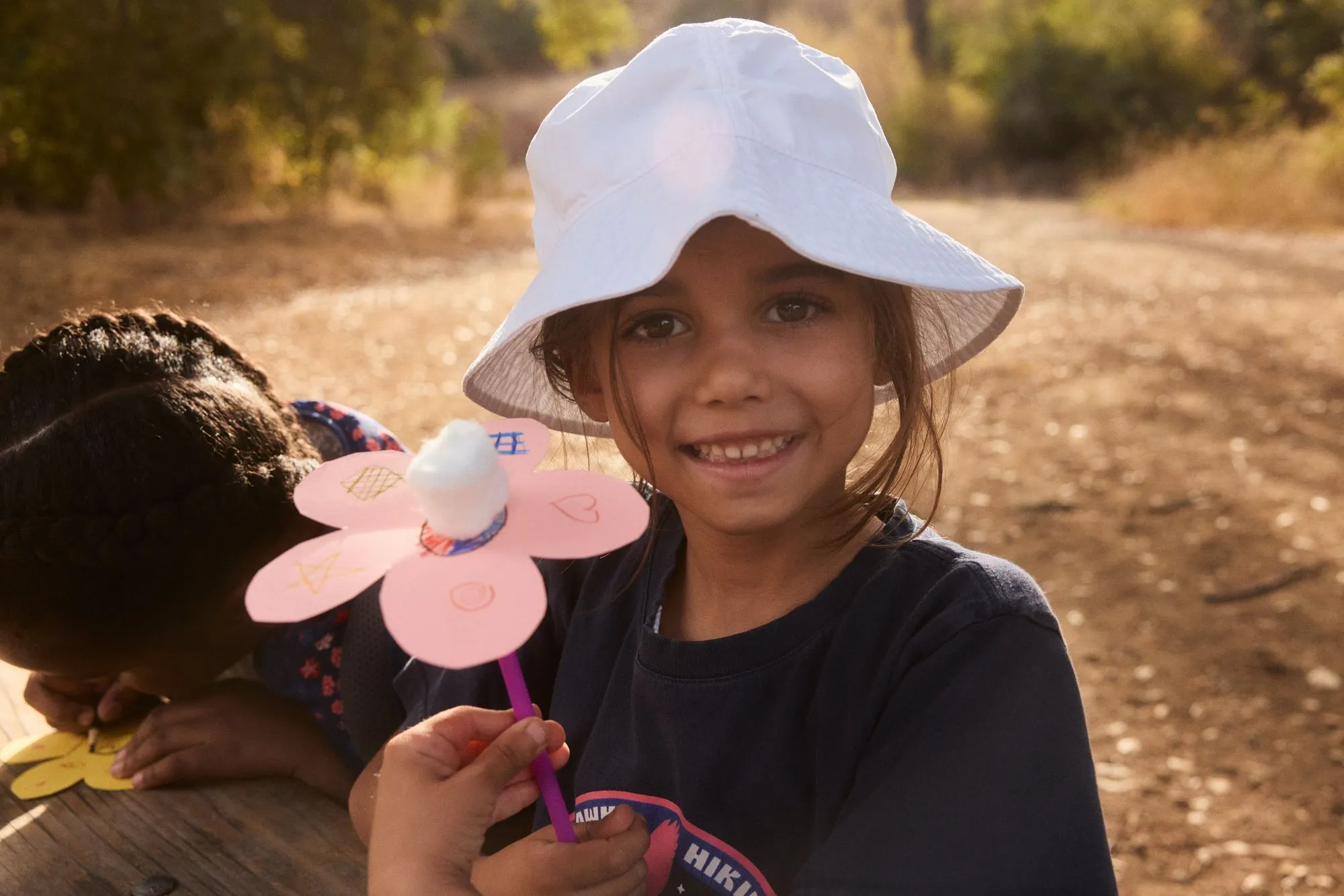 girl smiling outdoors hiking program playing
