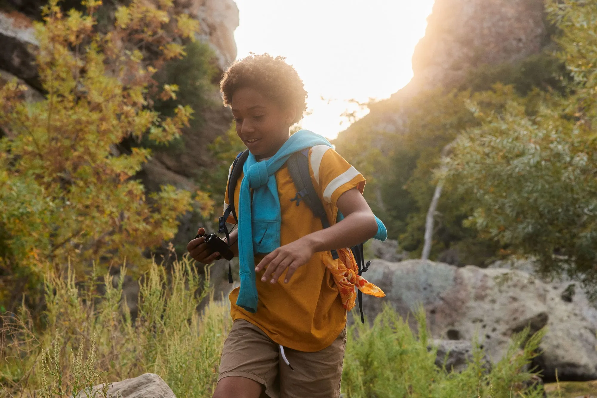 child hiking with backpack outdoor adventure