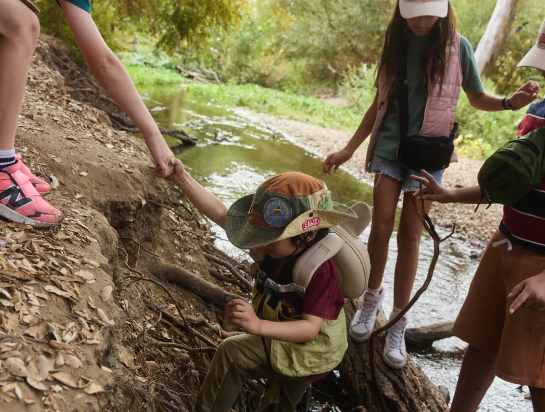 kids exploring creek hands on nature activity