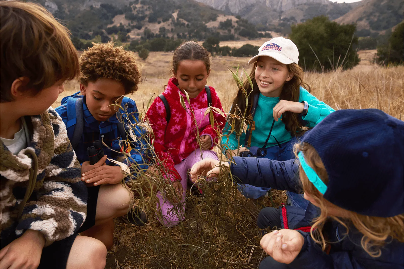 kids sitting together outdoor learning activity