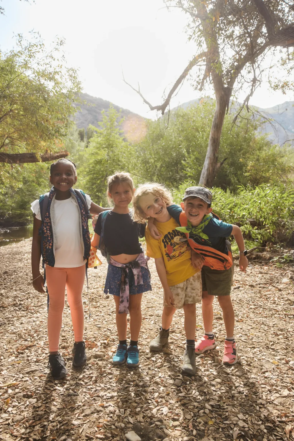 kids group walking desert trail outdoor program